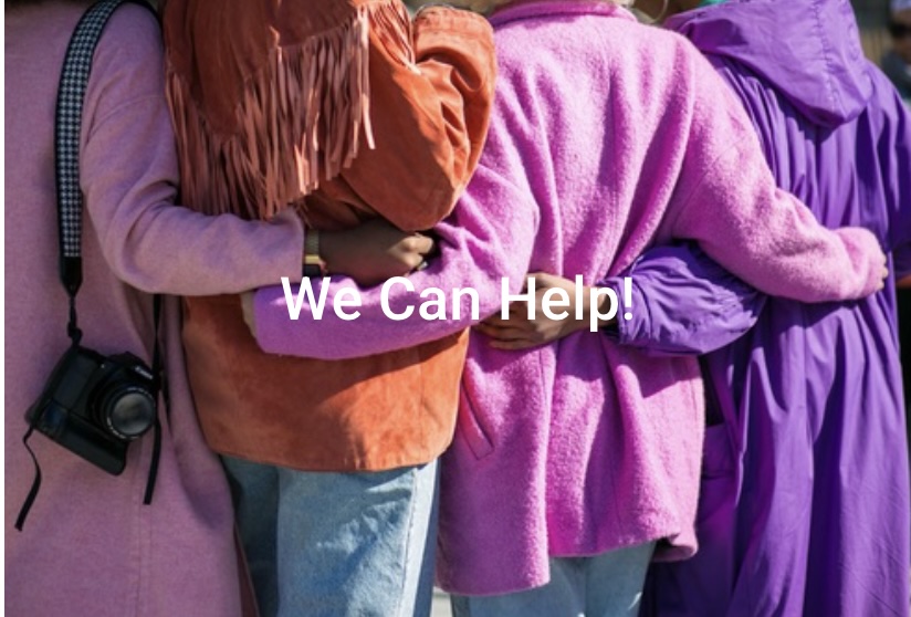 People in colorful clothes hugging, with text "We Can Help!"